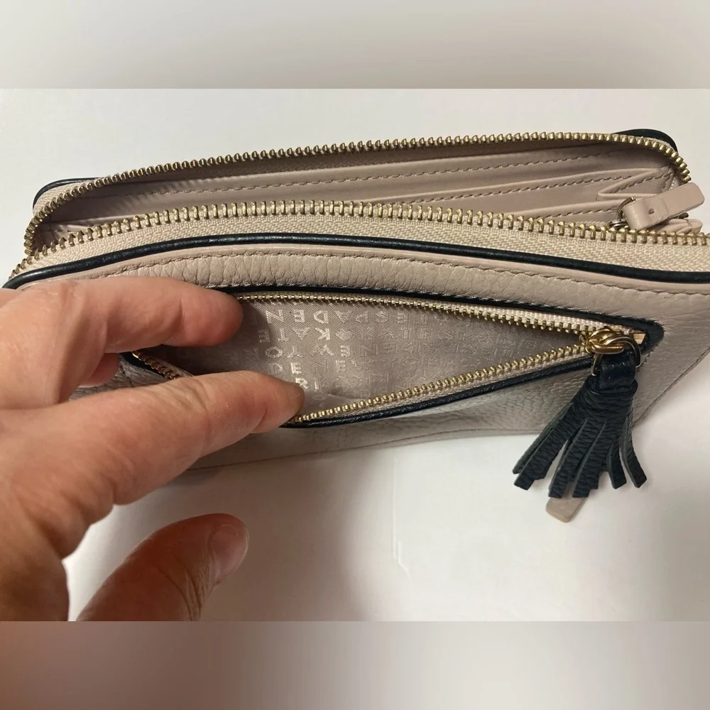 Kate Spade wallet pebble texture leather mauve color black trim tassel